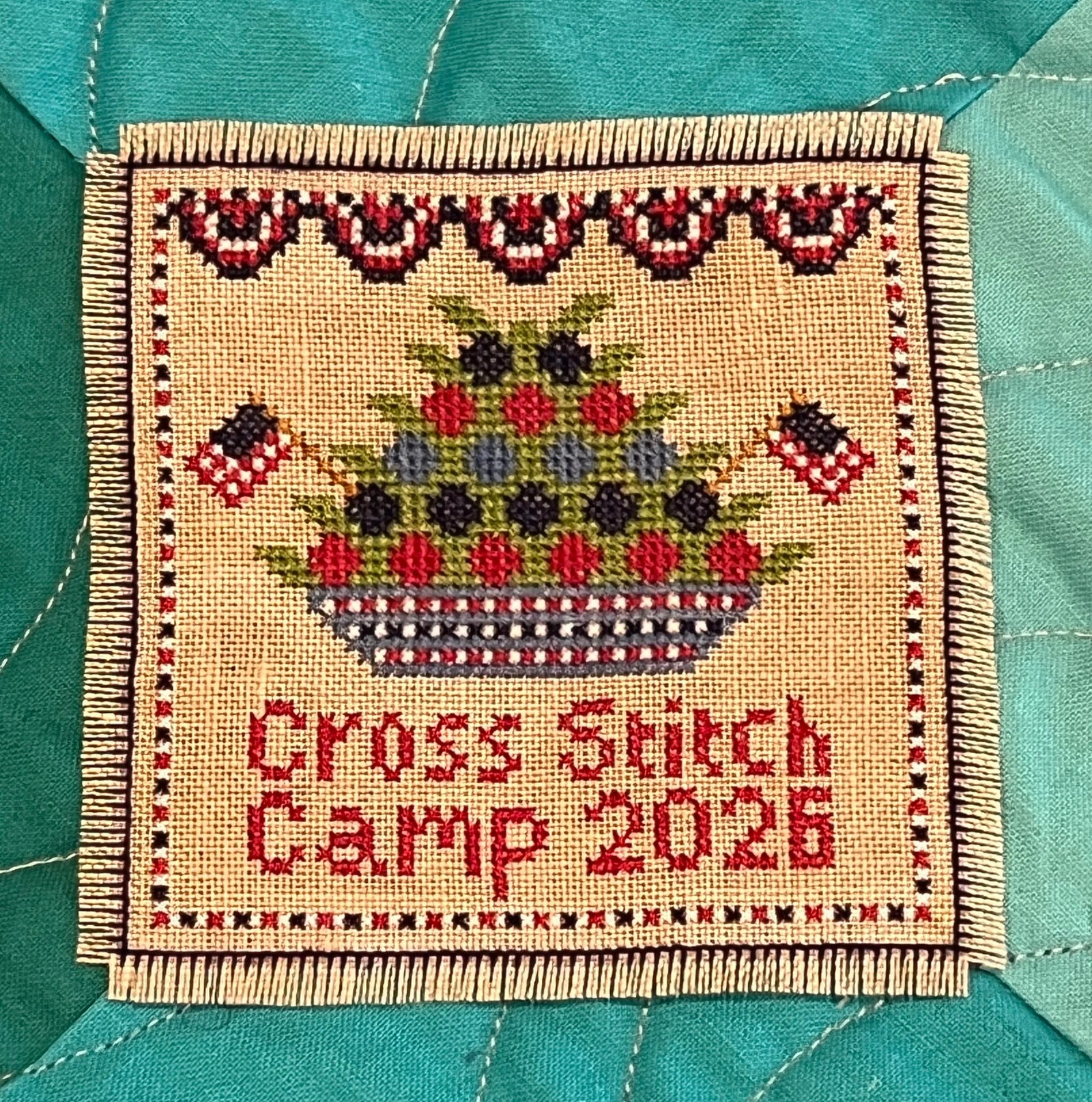 2026 Summer Cross Stitch Camp Badge by Colorado Cross Stitcher Colorado Cross Stitcher